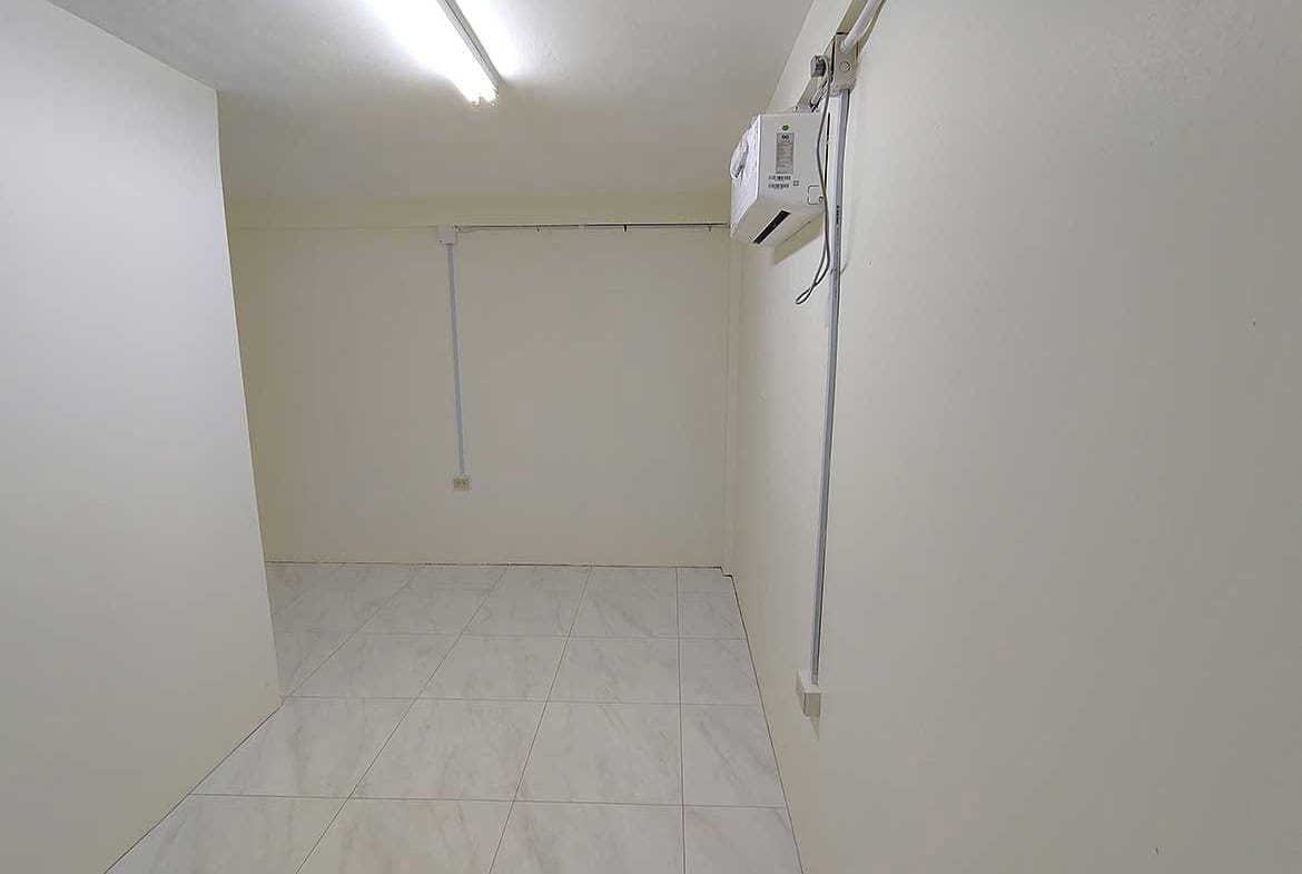 Cornerstone- Empty commercial space with white walls and tiled floor in Curepe.