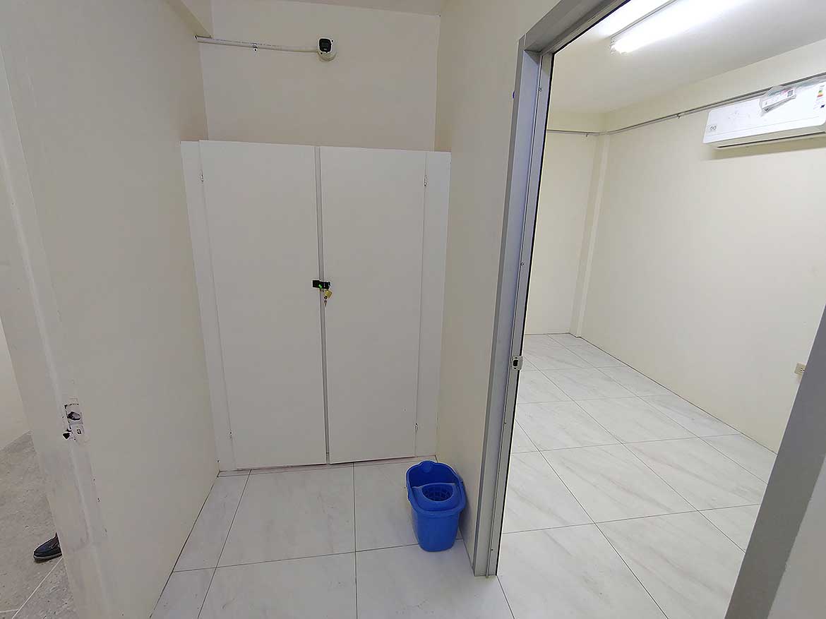 Commercial Space in Curepe Cornerstone- Empty commercial room with white walls and tiled floor in Curepe.