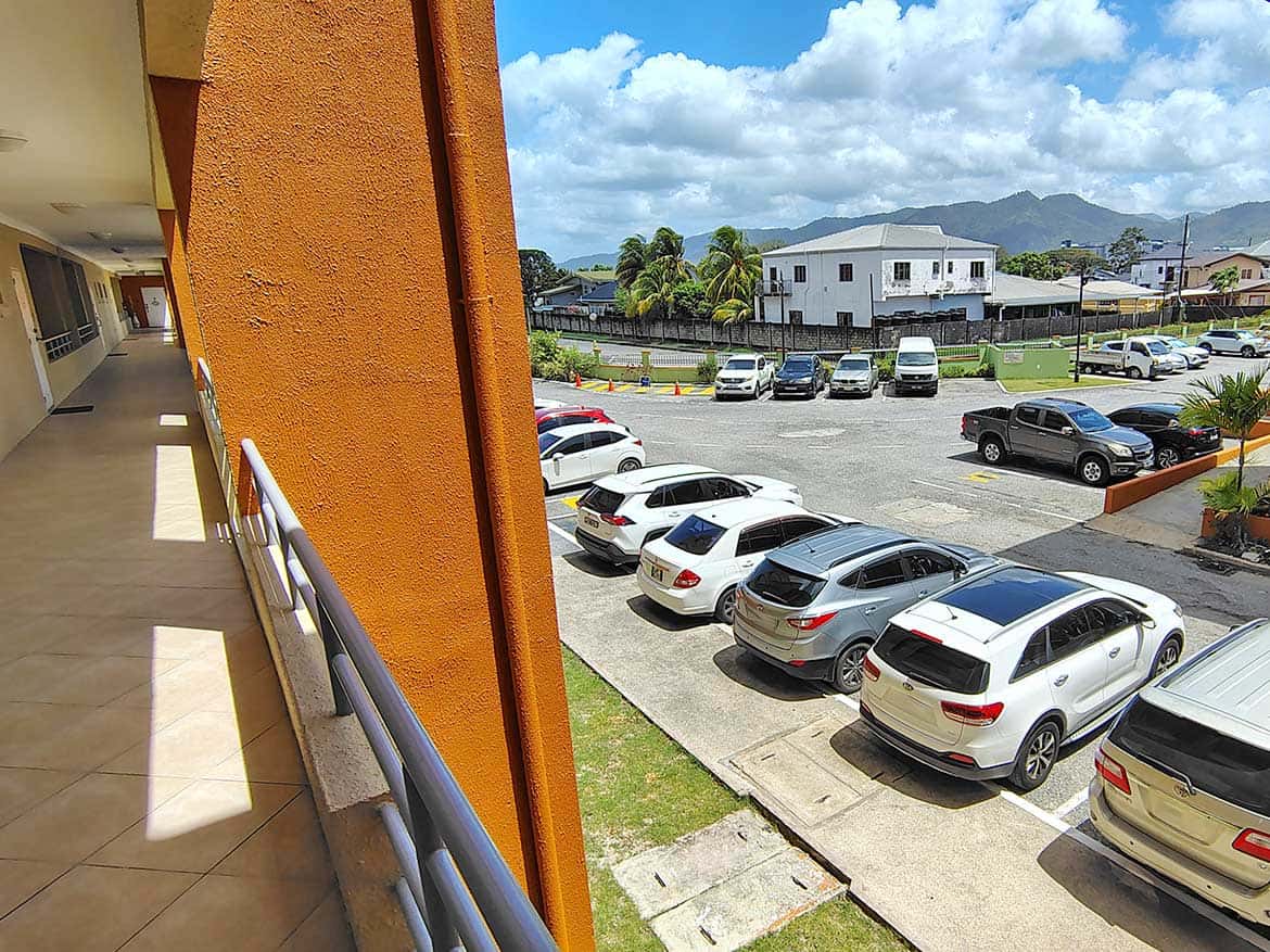 EastGate on the Greens Parking Lot View Parking lot view at EastGate on the Greens with cars and mountains in background.