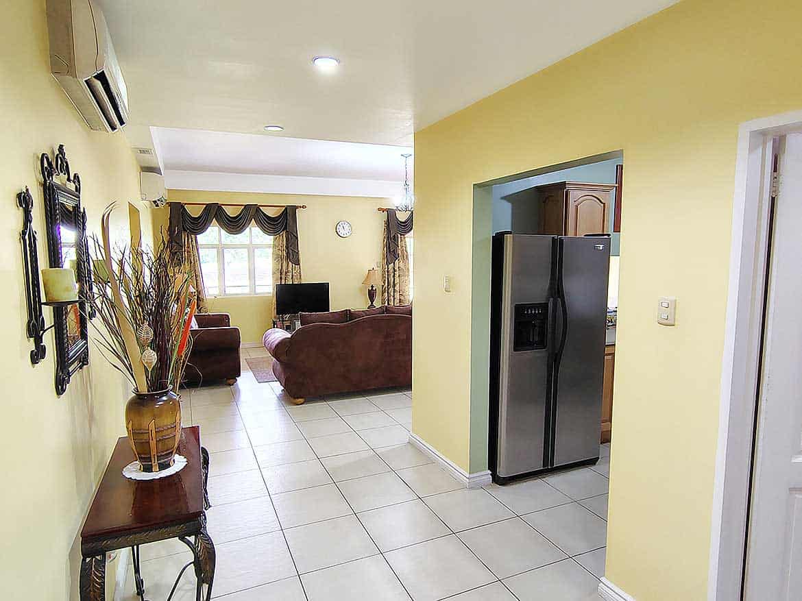 EastGate on the Greens Interior View Spacious living room with modern furniture and kitchen area at EastGate on the Greens.
