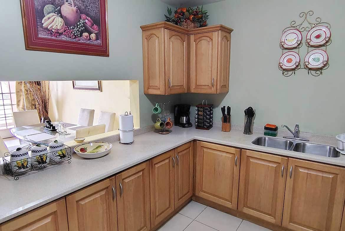 Cozy kitchen with wooden cabinets and modern appliances at Cornerstone™.