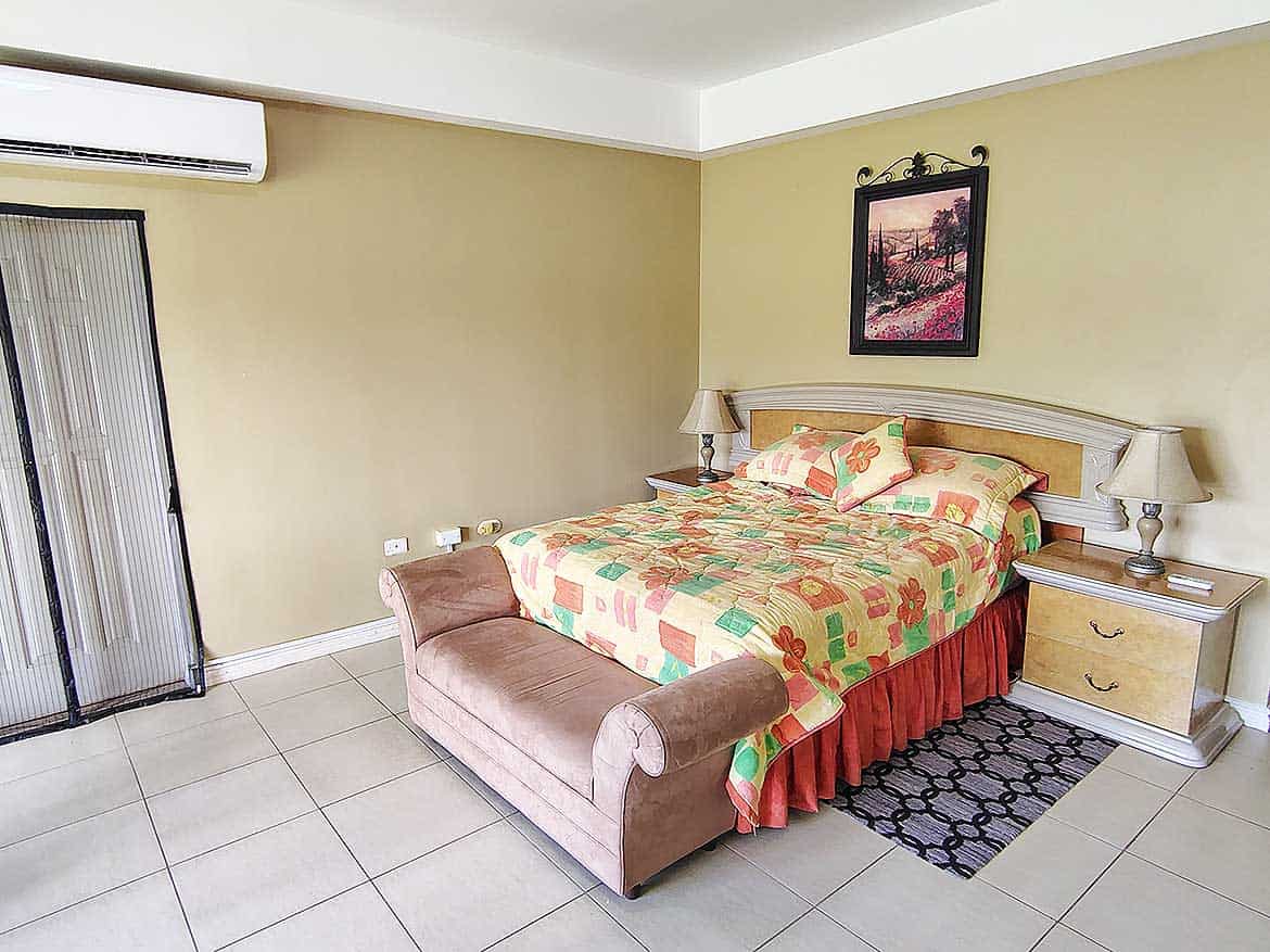 Comfortable Bedroom at EastGate on the Greens Cozy bedroom with colorful bedding and a large bed at EastGate on the Greens.
