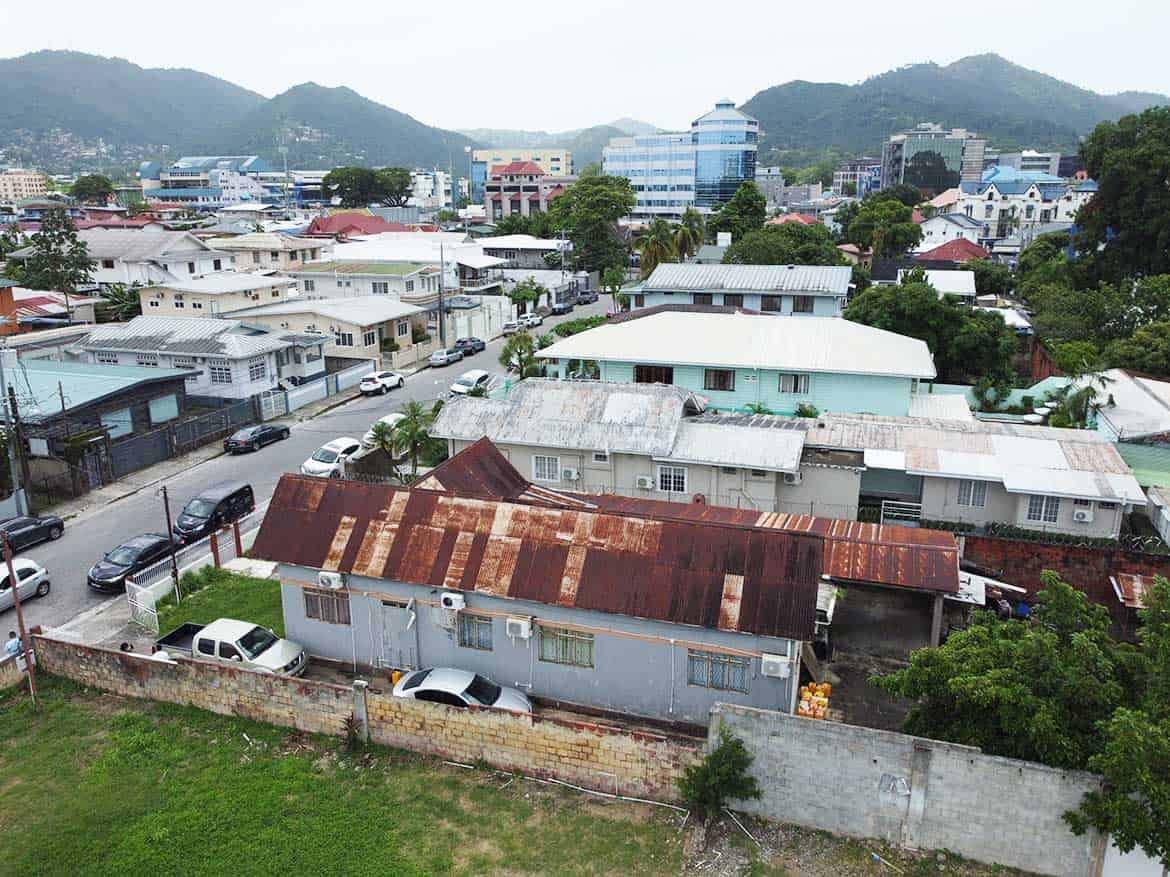 Carlos Street Woodbrook Neighborhood Cornerstone- Aerial view of Carlos Street in Woodbrook with mixed residential and commercial buildings.