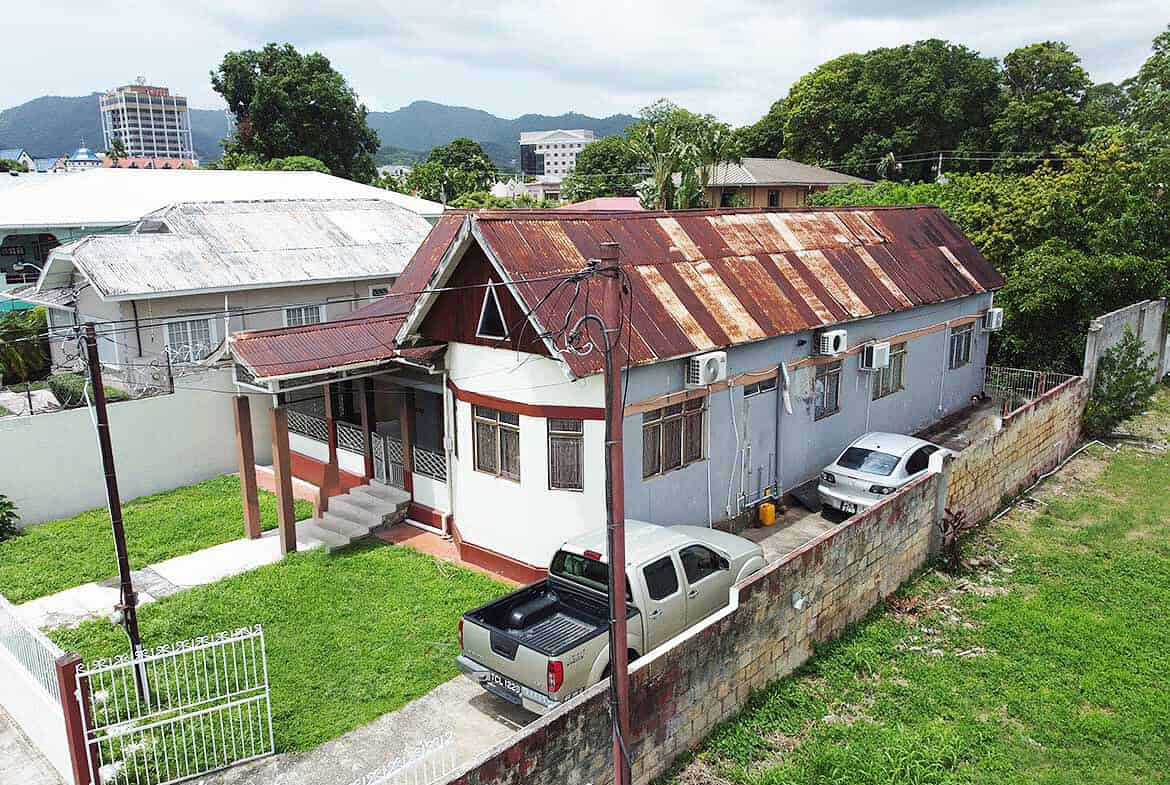 Cornerstone- Residential house on Carlos Street, Woodbrook with parking and greenery.