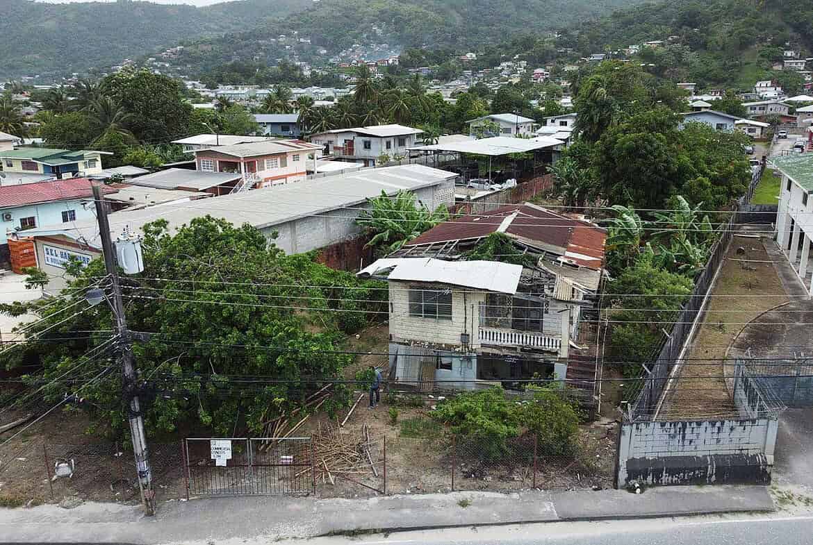 Cornerstone- View of houses and greenery along St Lucien Road in a hilly neighborhood.