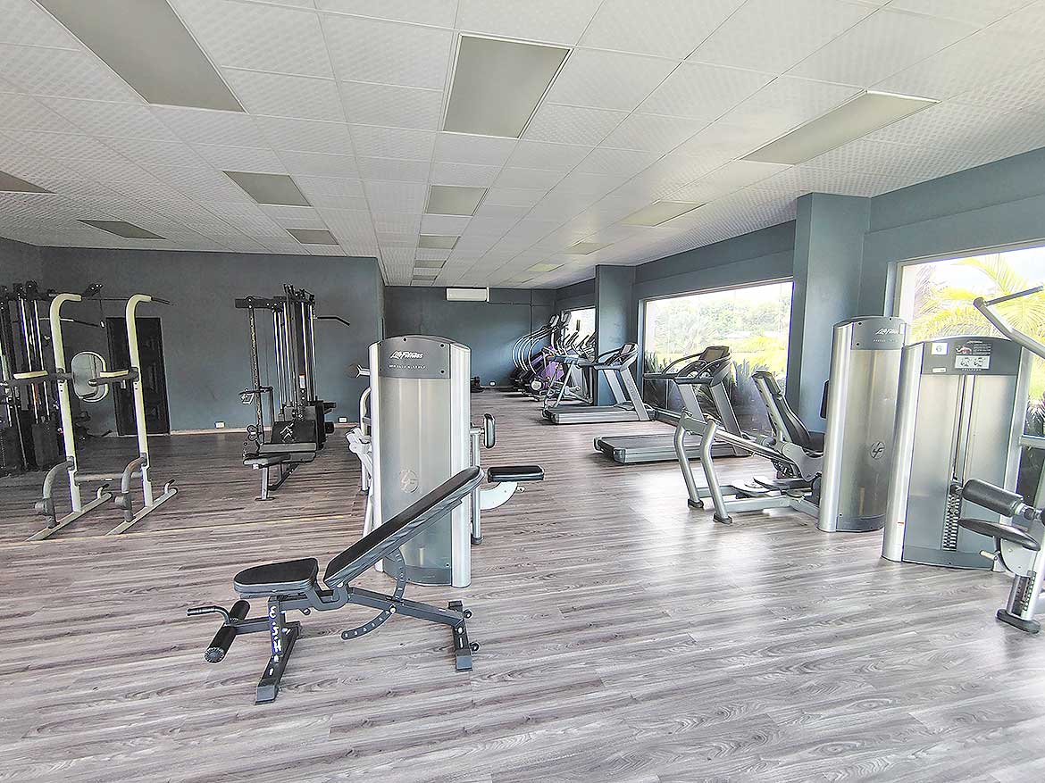 Cornerstone™ Fitness Center at Ella Vista Gardens Modern gym with cardio and strength equipment at Ella Vista Gardens.