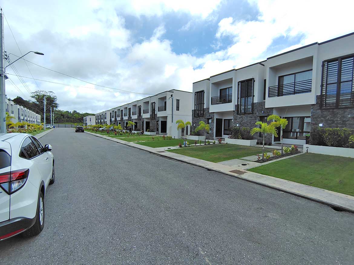 Ella Vista Gardens Modern Townhouses Contemporary townhouses at Ella Vista Gardens with landscaped front yards.