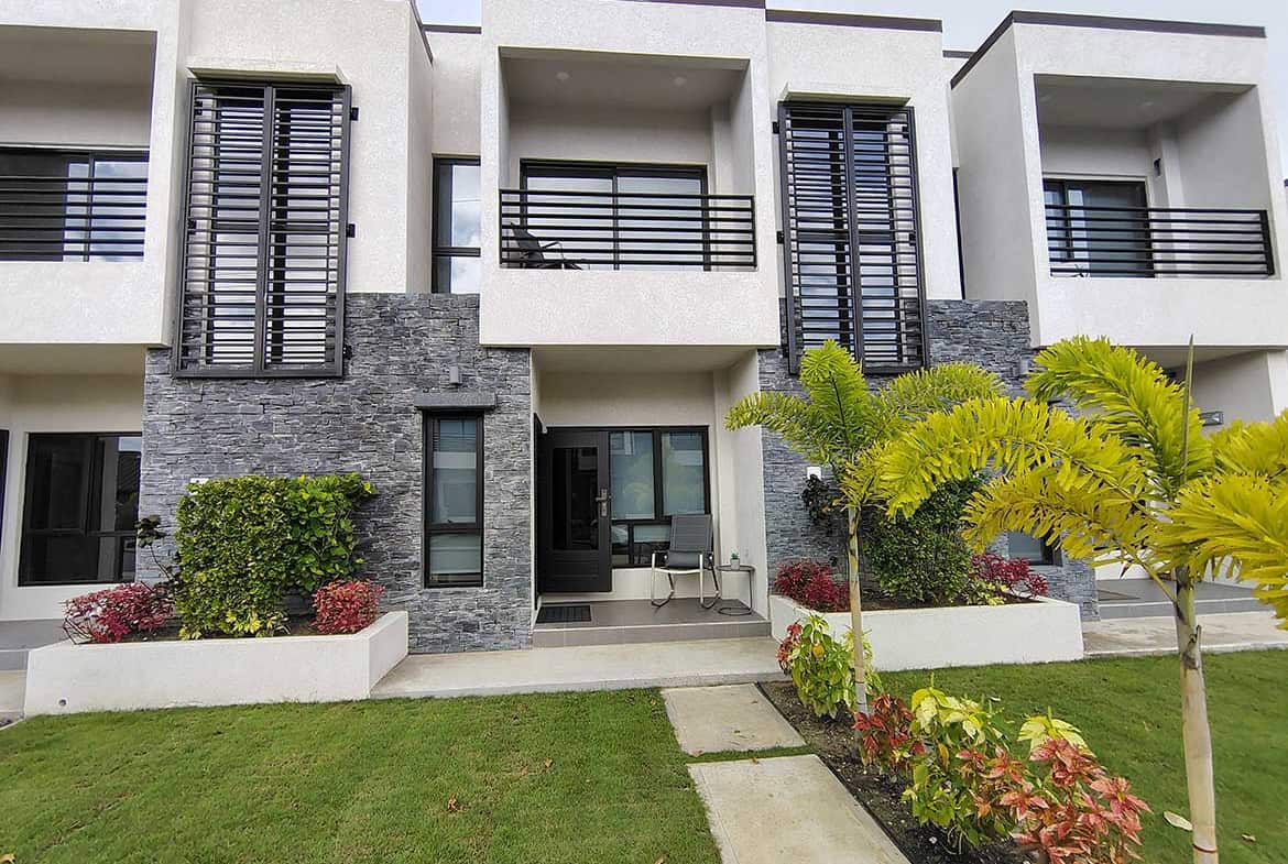 Modern townhouse with landscaped garden and balcony at Ella Vista Gardens.