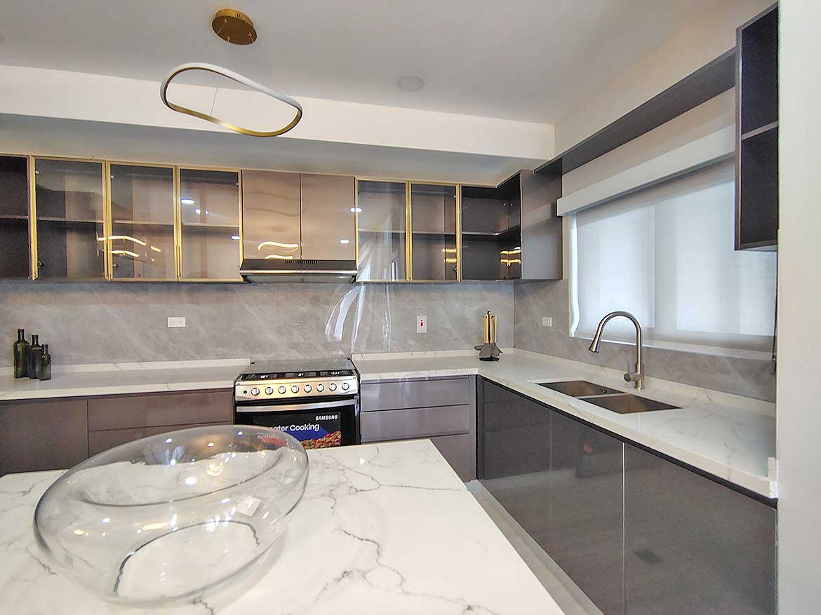 Modern Kitchen at Ella Vista Gardens Contemporary kitchen with marble countertops and sleek cabinetry at Ella Vista Gardens.