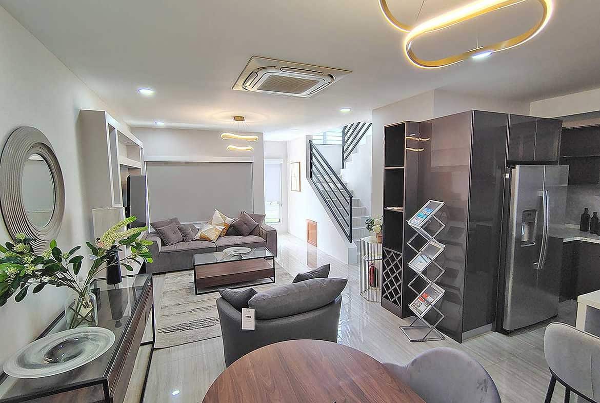 Contemporary living room with stylish furniture and modern lighting fixtures.