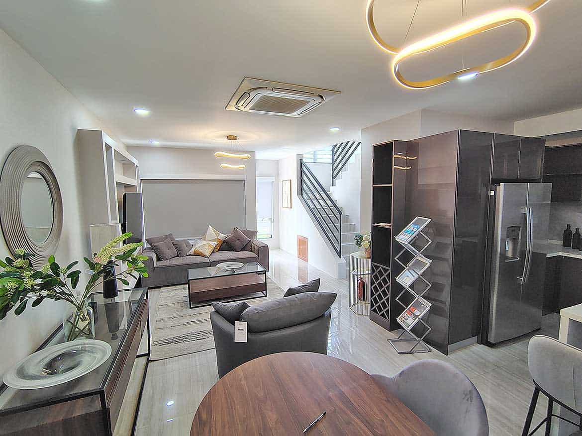 Modern Living Room at Ella Vista Gardens Contemporary living room with stylish furniture and modern lighting fixtures.