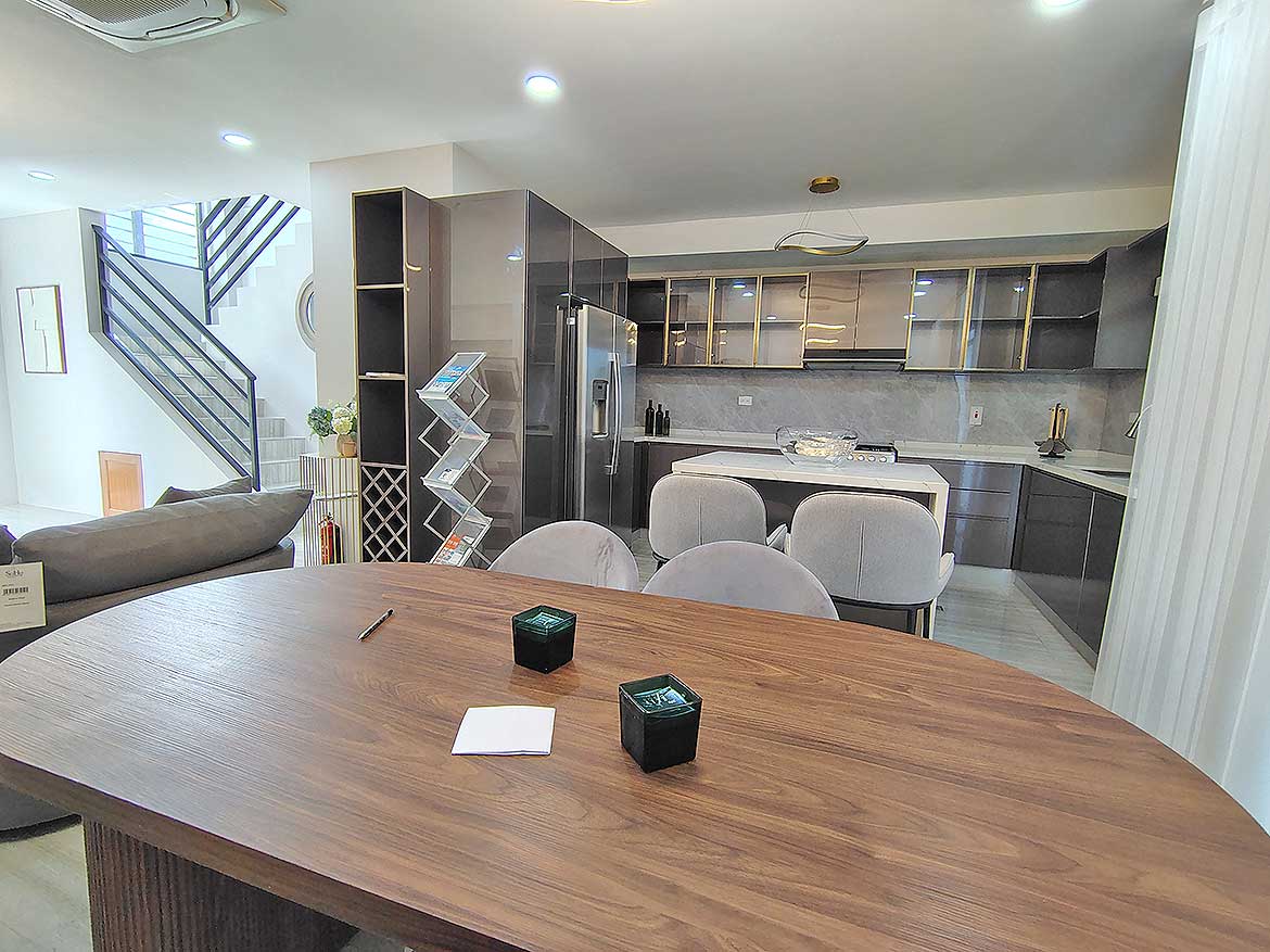 Modern Kitchen and Dining Area Contemporary kitchen with dining table and seating in Ella Vista Gardens.