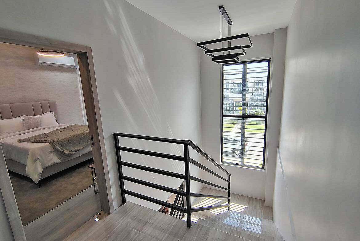 Bright staircase area in Ella Vista Gardens residential complex.