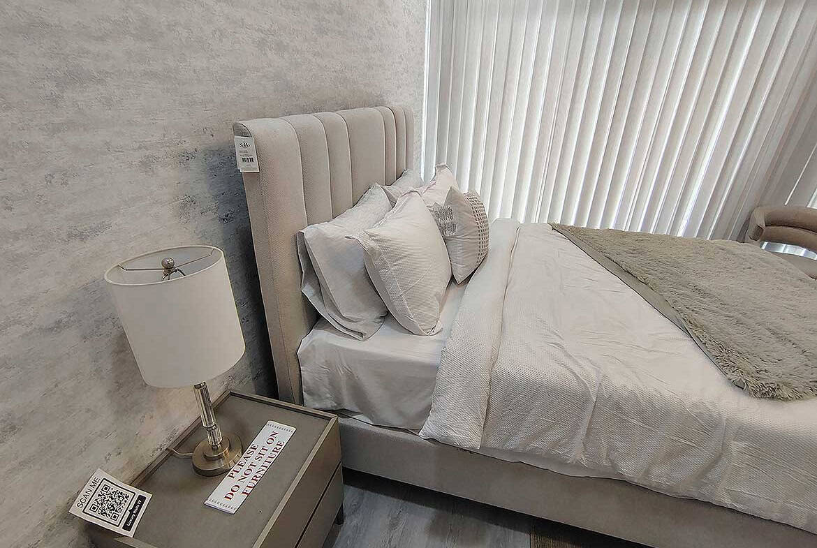 Modern bedroom with a plush bed and stylish decor at Ella Vista Gardens.