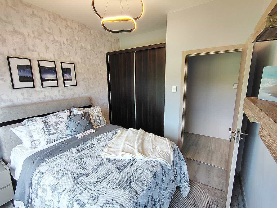 Modern Bedroom at Ella Vista Gardens Contemporary bedroom with stylish decor and cozy bedding at Ella Vista Gardens.
