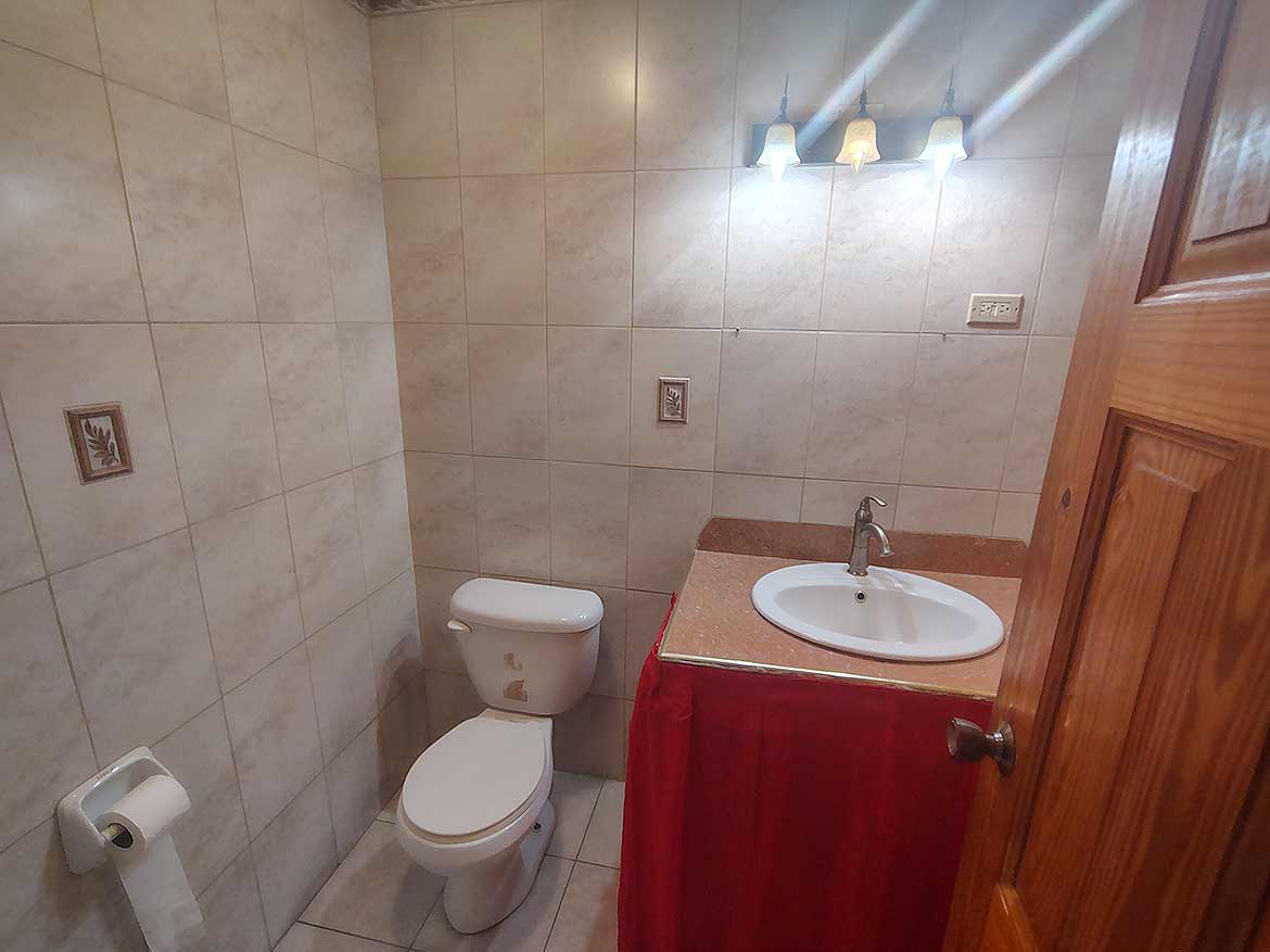 Bathroom Interior in Cleaver Road, Arima Cornerstone- Clean bathroom with toilet and sink in Cleaver Road, Arima.