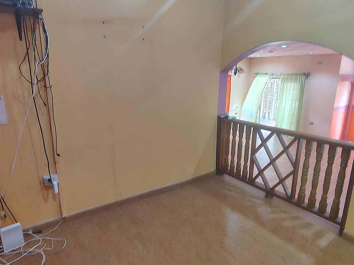 Interior View of Cornerstone™ Property Cornerstone- Spacious interior with yellow walls and wooden railing at Cornerstone™ property.