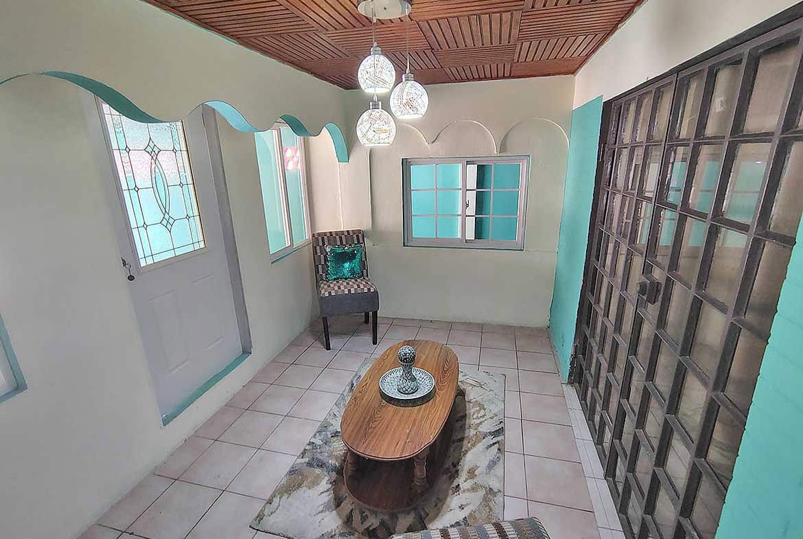 Bright interior space with wooden ceiling, stained glass windows, and modern decor.