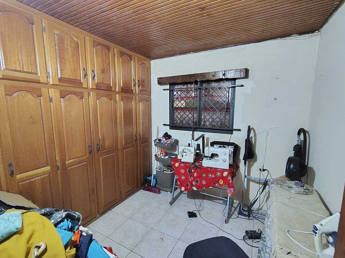 Cornerstone™ Alexander Street Room Cozy room with wooden cabinets and small appliances on a table.
