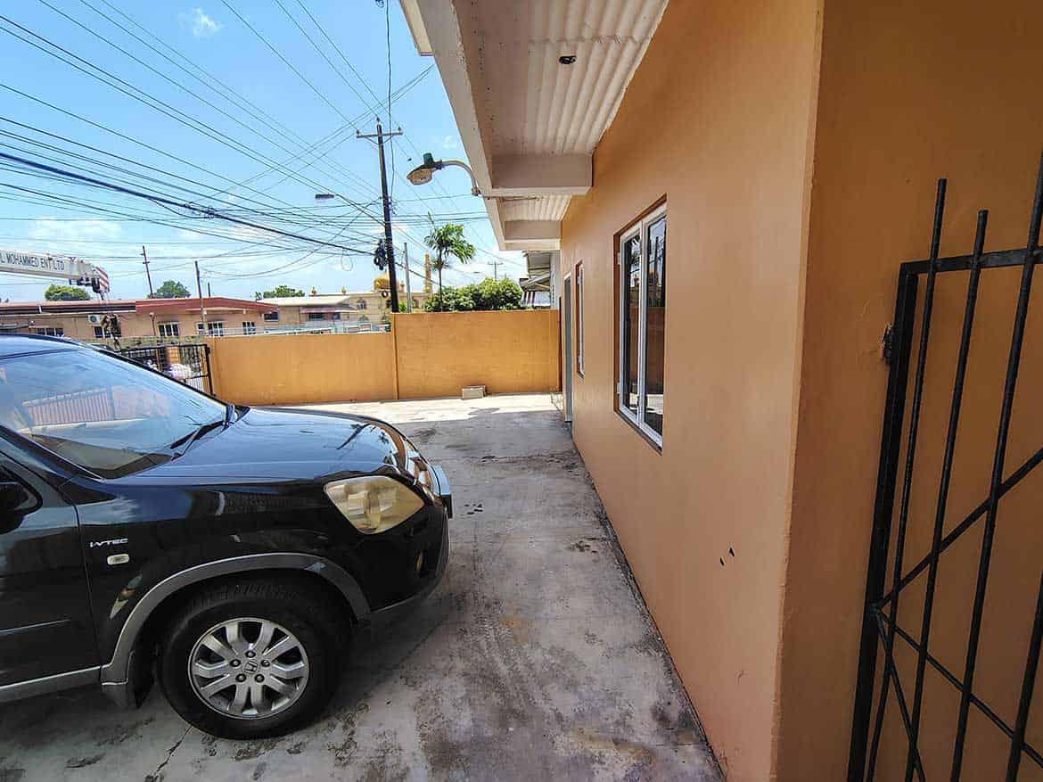 Cornerstone™ EMR Tacarigua Apt 4 Cornerstone- Parking area outside Cornerstone™ EMR Tacarigua Apt 4 building.