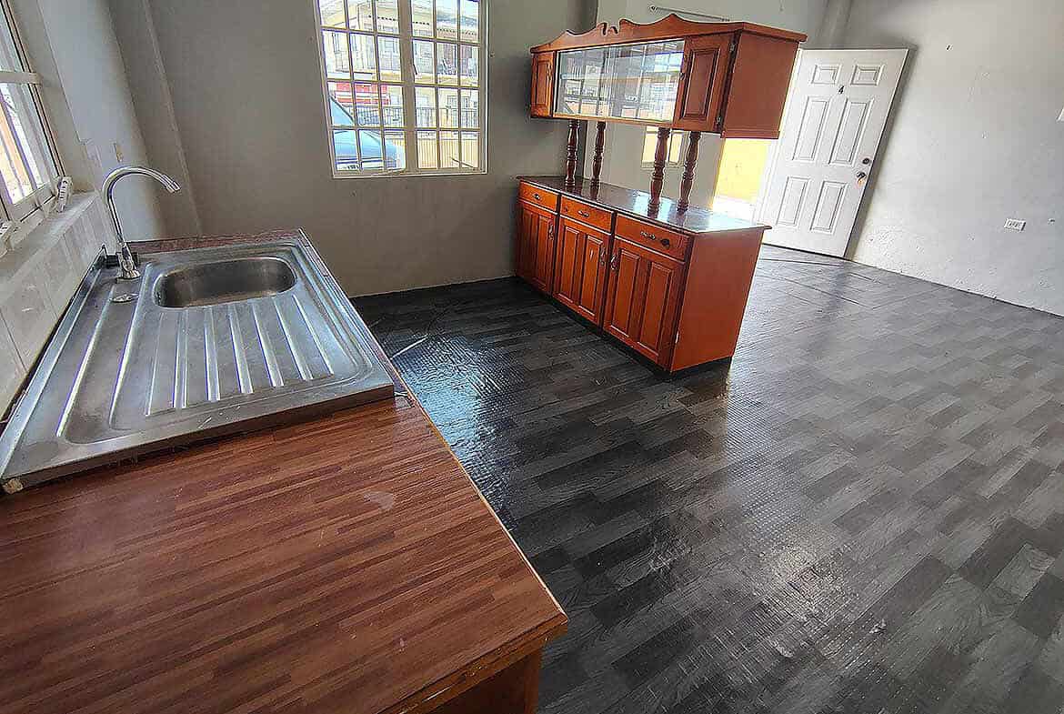 Cornerstone- Spacious apartment interior with kitchen and dining area in Tacarigua.