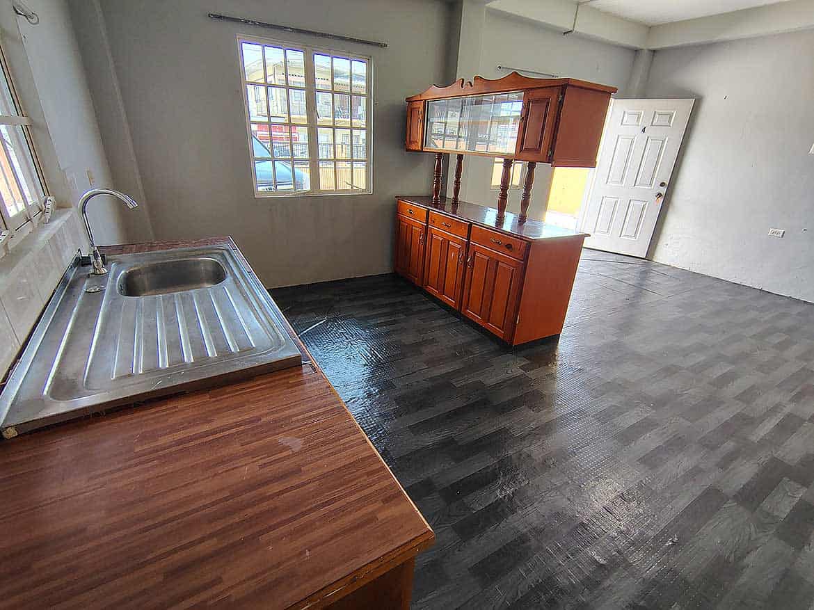 Interior of EMR Tacarigua Apt 4 Cornerstone- Spacious apartment interior with kitchen and dining area in Tacarigua.