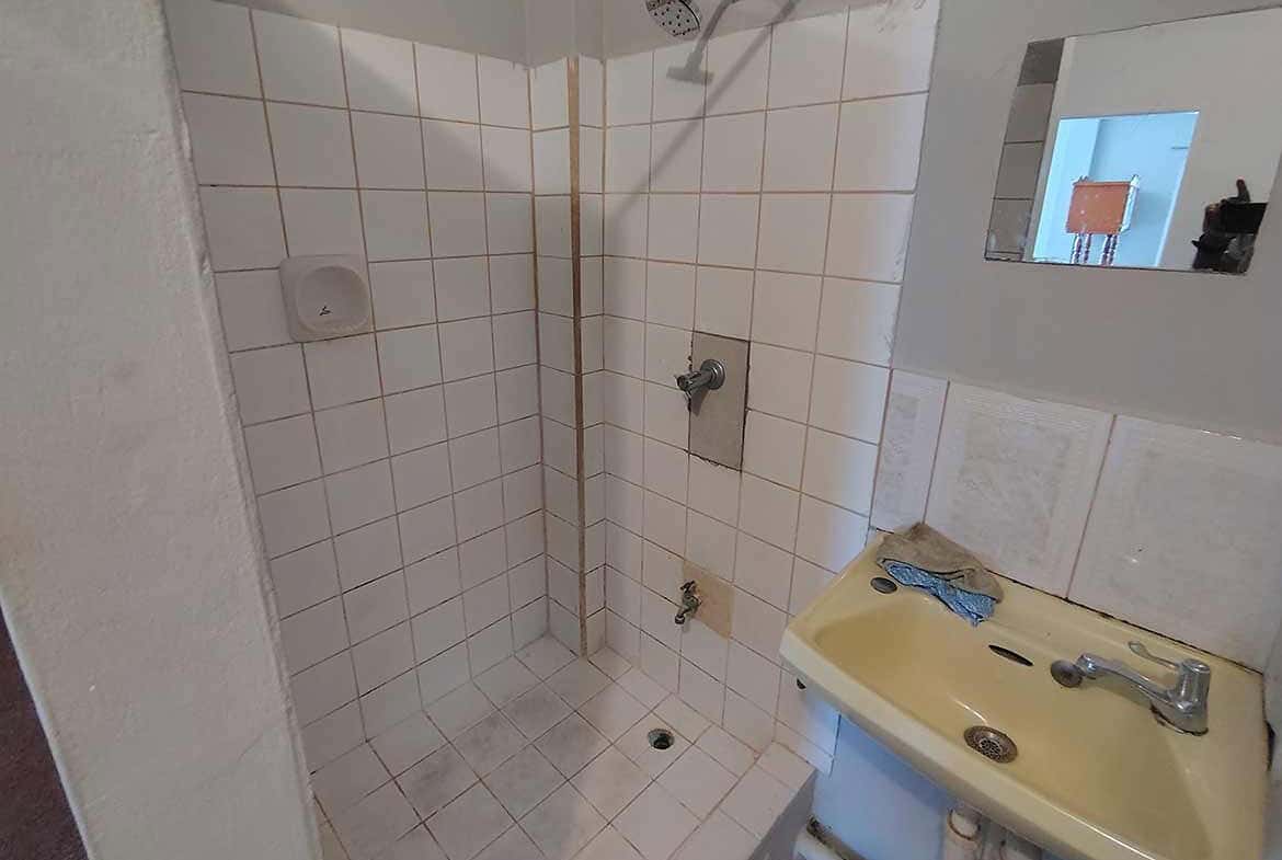 Cornerstone- Bathroom with shower and sink in Cornerstone™ EMR Tacarigua Apt 4.