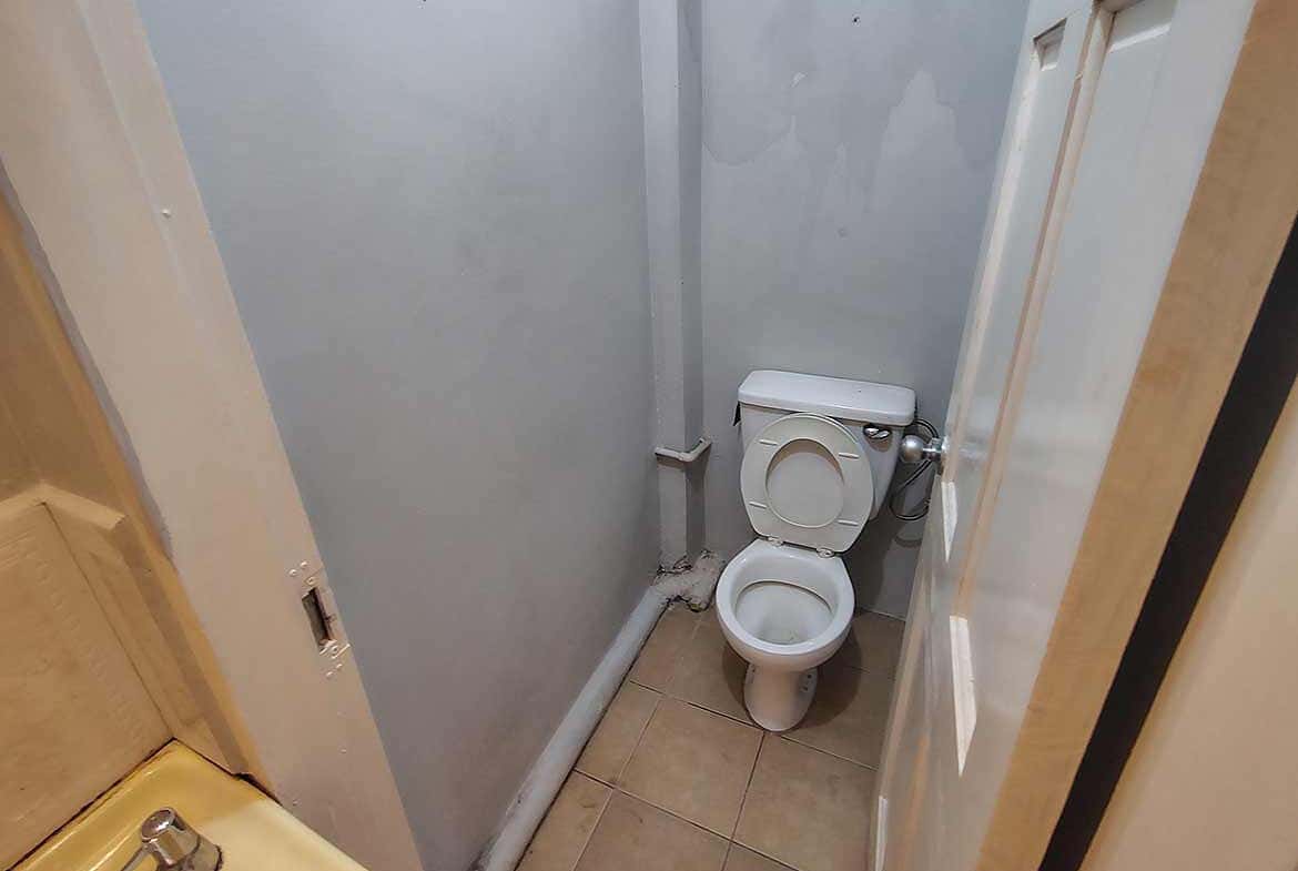 Cornerstone- Compact bathroom with toilet in EMR Tacarigua Apt 4.