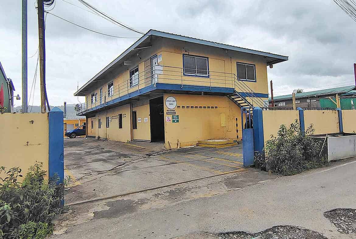 Cornerstone- Yellow two-story office building with blue accents on Johnny King Road.