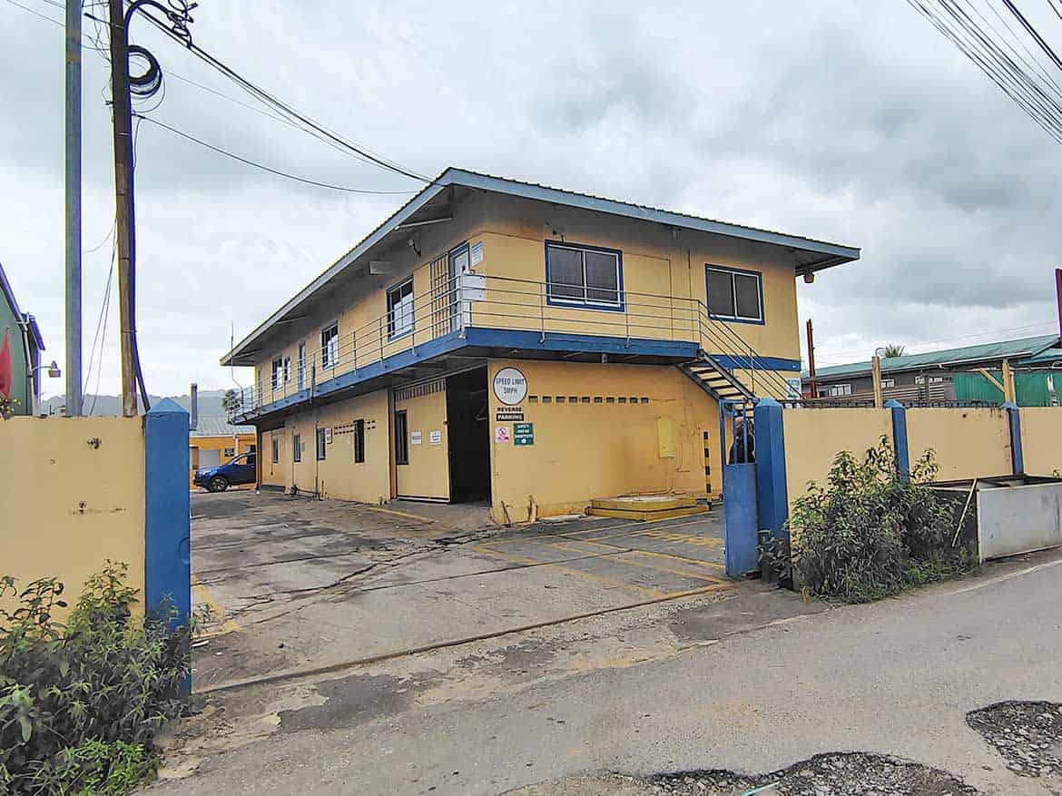 Cornerstone™ Office Building on Johnny King Road Cornerstone- Yellow two-story office building with blue accents on Johnny King Road.