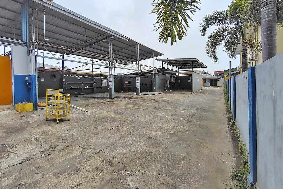 Cornerstone- Outdoor Cornerstone™ facility with covered service area and palm trees.