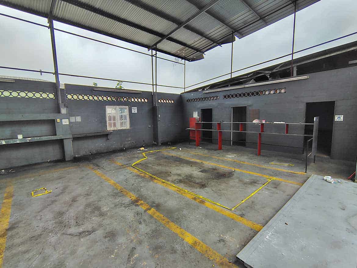 Cornerstone™ Parking Area on Johnny King Road Cornerstone- Empty parking lot with marked spaces and a metal roof cover.