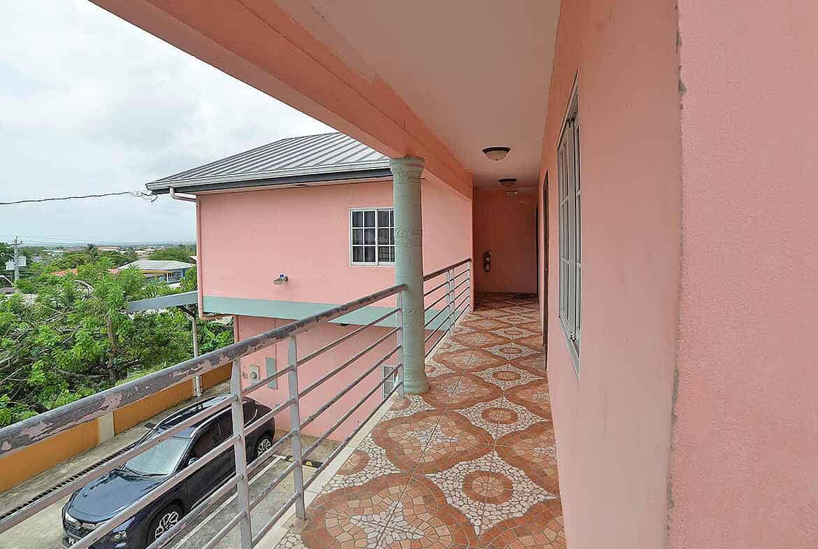 Cornerstone- Balcony of Cornerstone™ property in Arima with scenic surroundings.