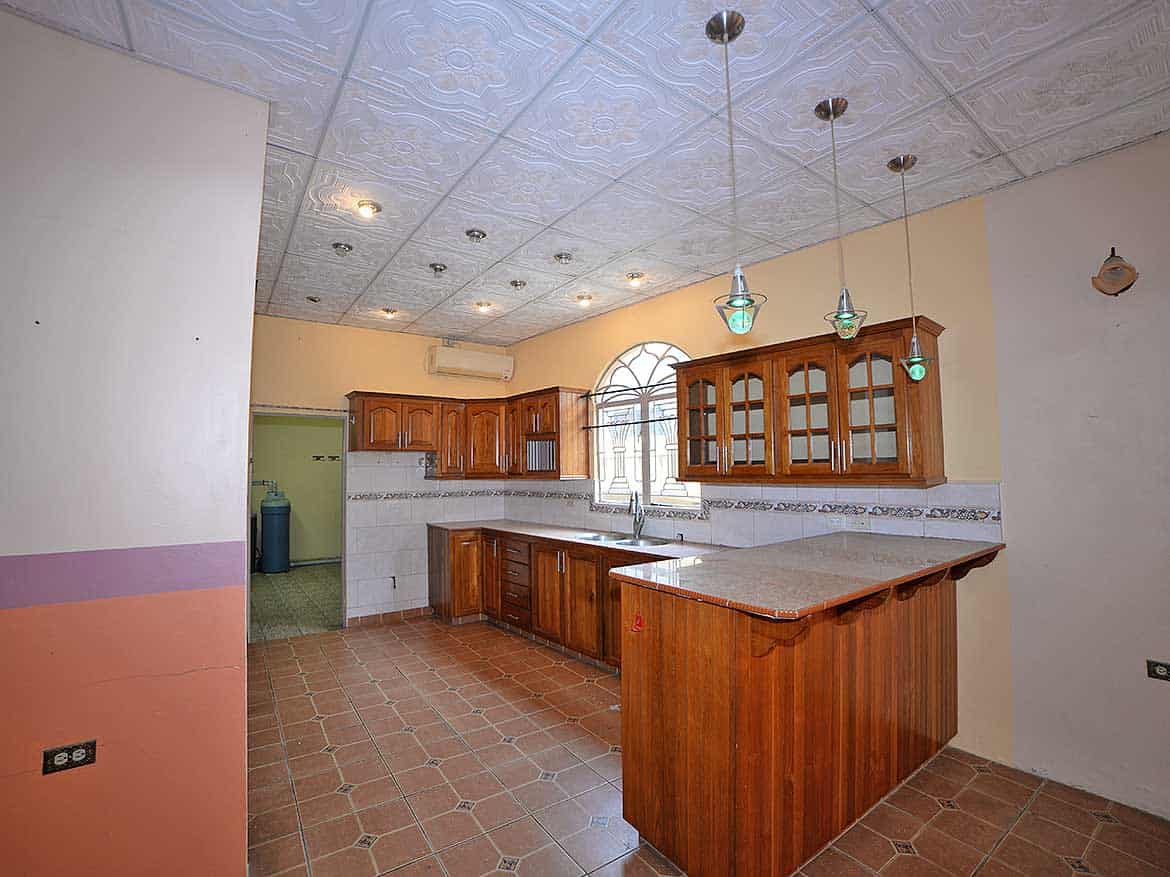 Cornerstone™ Kitchen in Cleaver Road, Arima Cornerstone- Spacious kitchen with wooden cabinets and tiled flooring in Cleaver Road, Arima.