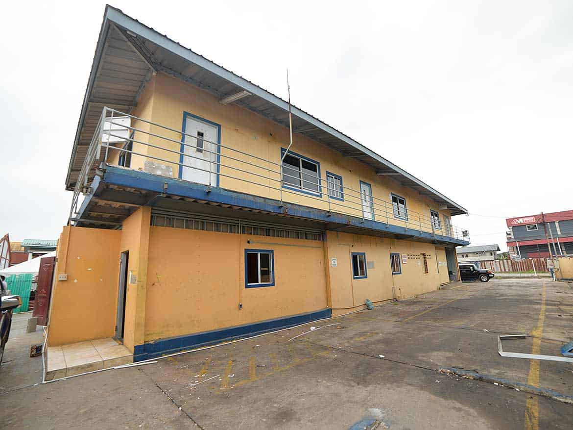 Cornerstone™ Building on Johnny King Road Cornerstone- Two-story Cornerstone™ building with yellow walls and blue accents on Johnny King Road.