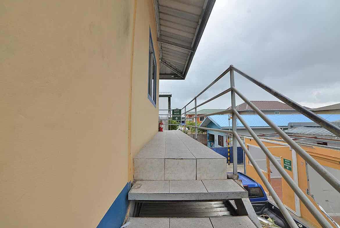 Cornerstone- View of building exterior with stairs and railing at Cornerstone™.