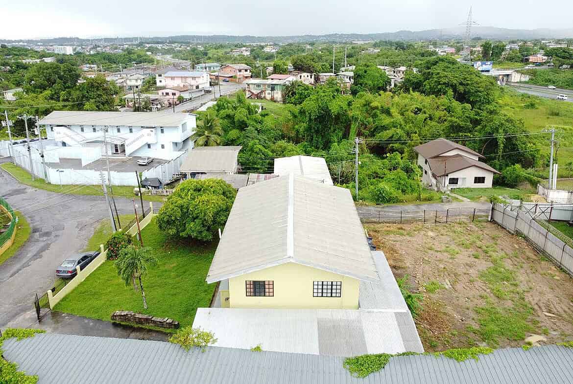 Cornerstone- Aerial view of houses and greenery on Braemar Road, Corinth.