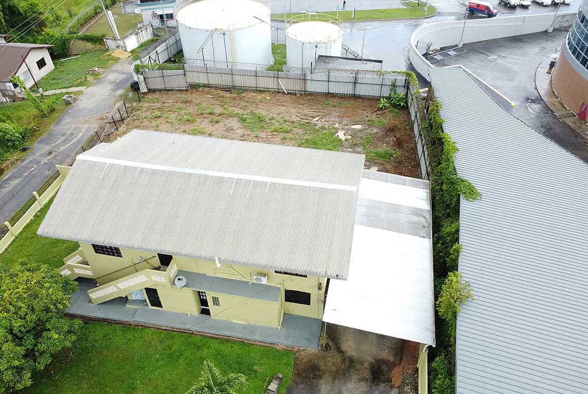 Cornerstone- Aerial view of a residential property on Braemar Road, Corinth with a large roof and surrounding lot.