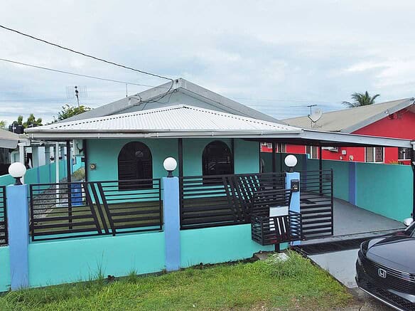 Cornerstone- Vibrant turquoise house with black accents in Cashew Gardens, Edinburgh.