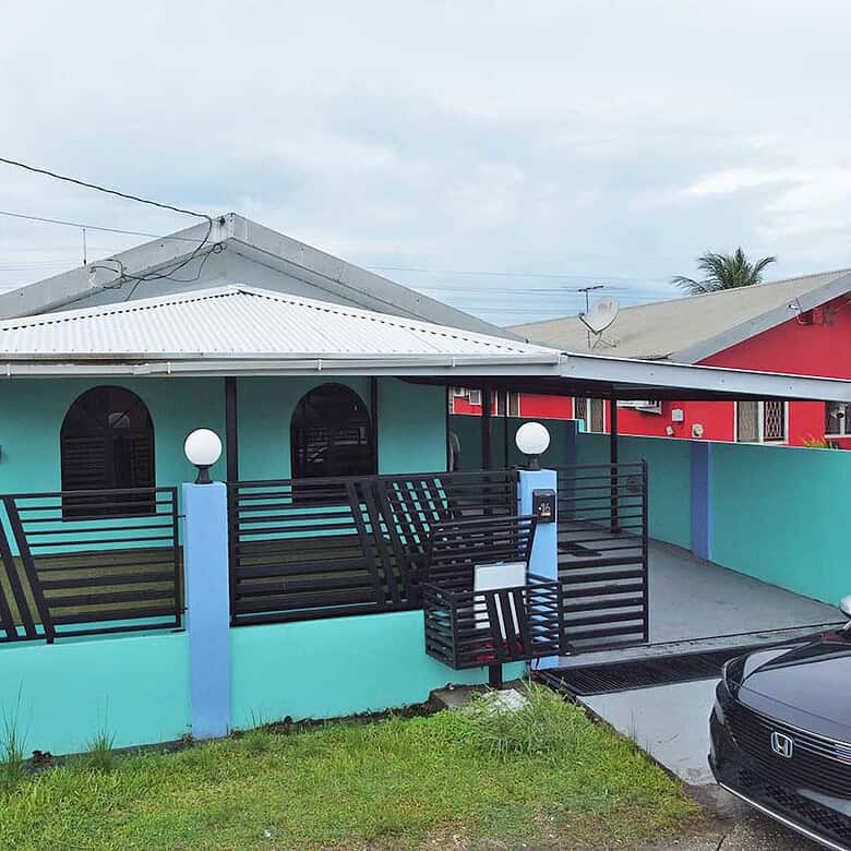 Cornerstone- Vibrant turquoise house with black accents in Cashew Gardens, Edinburgh.