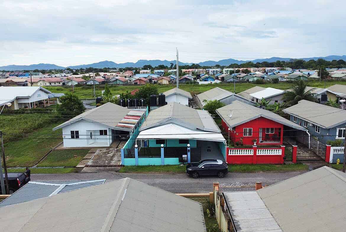 Cornerstone- Residential neighborhood in Edinburgh with colorful houses and mountain backdrop.
