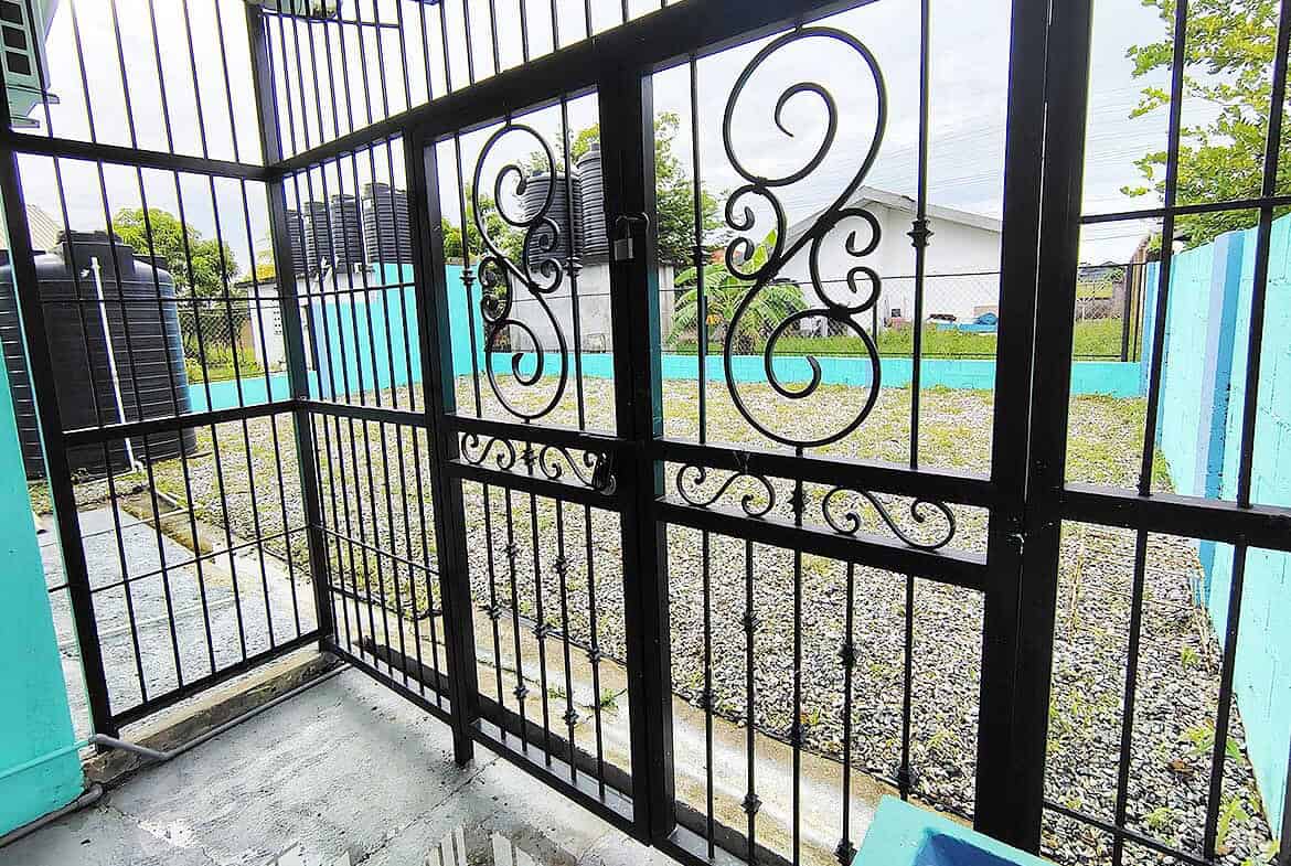 Cornerstone- Secure black metal gate at Cornerstone™ Cashew Gardens in Edinburgh.