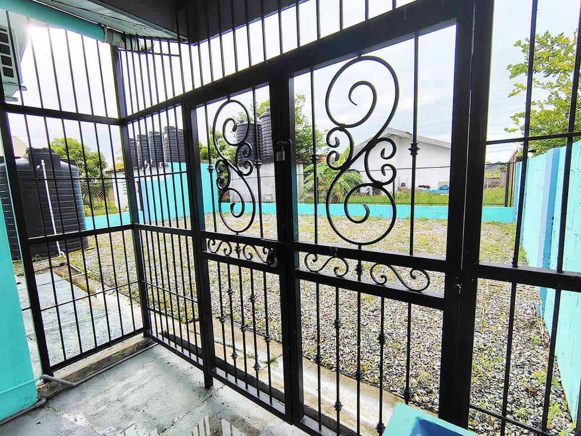 Cornerstone™ Cashew Gardens Enclosure Cornerstone- Secure black metal gate at Cornerstone™ Cashew Gardens in Edinburgh.