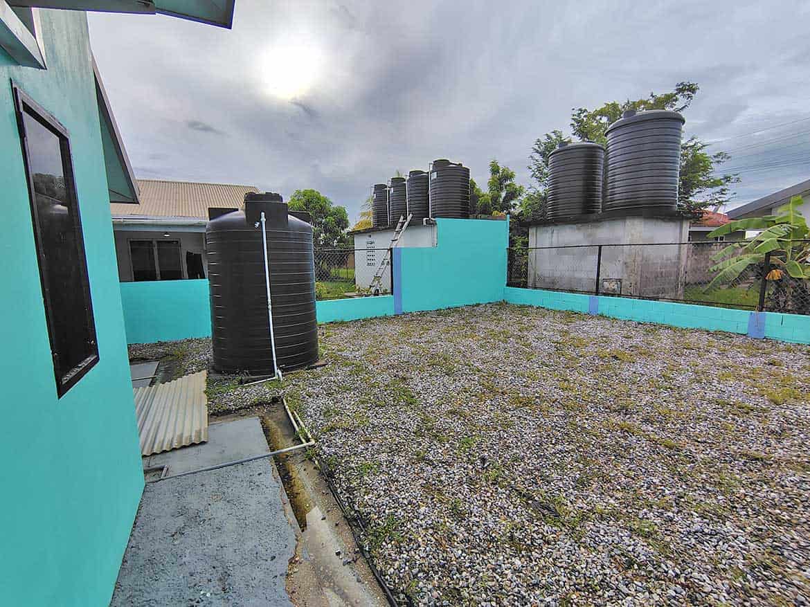 Water Storage Tanks at Cornerstone Cornerstone- Multiple black water tanks on rooftop in Edinburgh.
