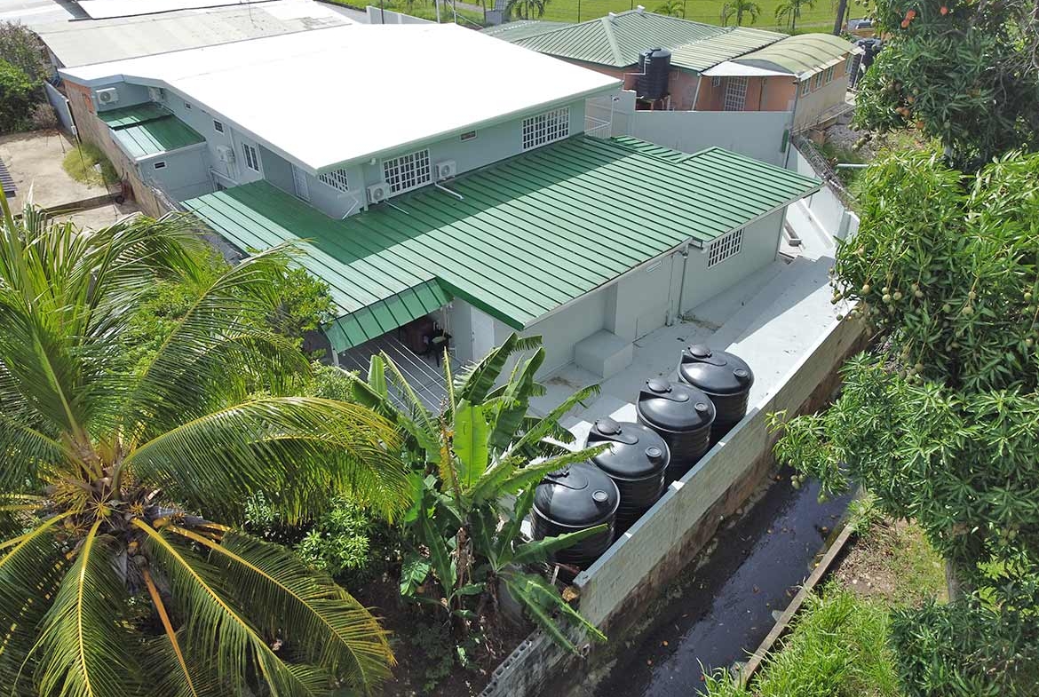 Cornerstone- Aerial view of Cornerstone™ apartment building with green roof and water tanks.