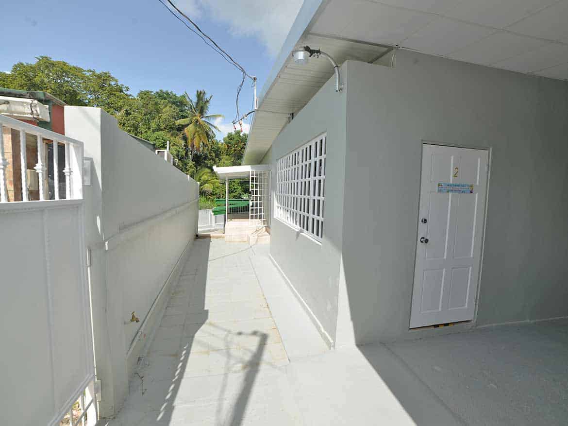 Cornerstone™ Apartment Building Exterior Cornerstone- Modern apartment building exterior with white walls and glass block windows.