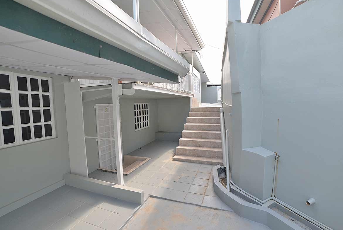 Cornerstone- Exterior view of Cornerstone™ apartment building with stairs and balcony.
