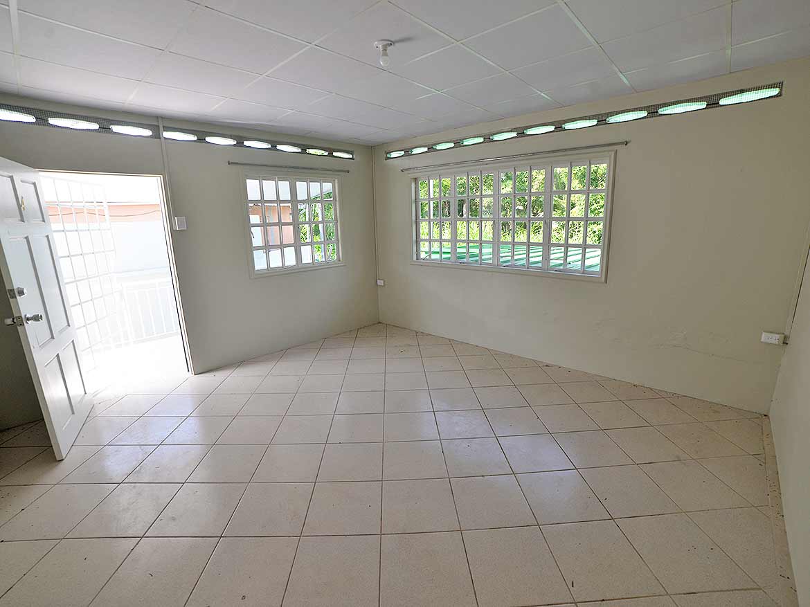 Interior of Apartment at Five Rivers Cornerstone- Empty room with large windows in Five Rivers apartment building.