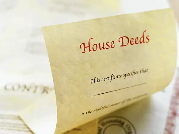 Cornerstone- Close-up of house deeds certificate with official seal and signature.